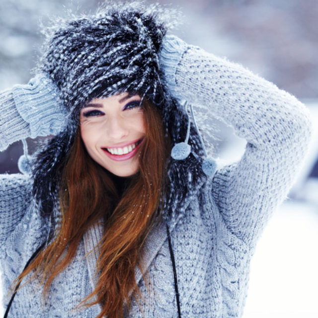 Young woman winter portrait in snow