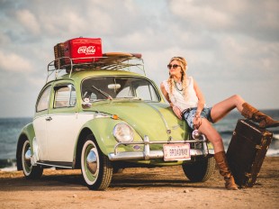 Beautiful model with vintage car and leather boots
