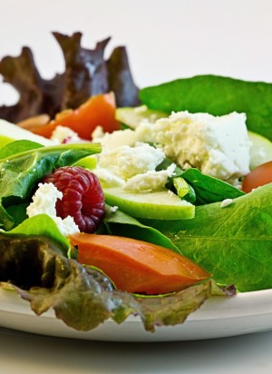 Fresh green spinach salad with cheese